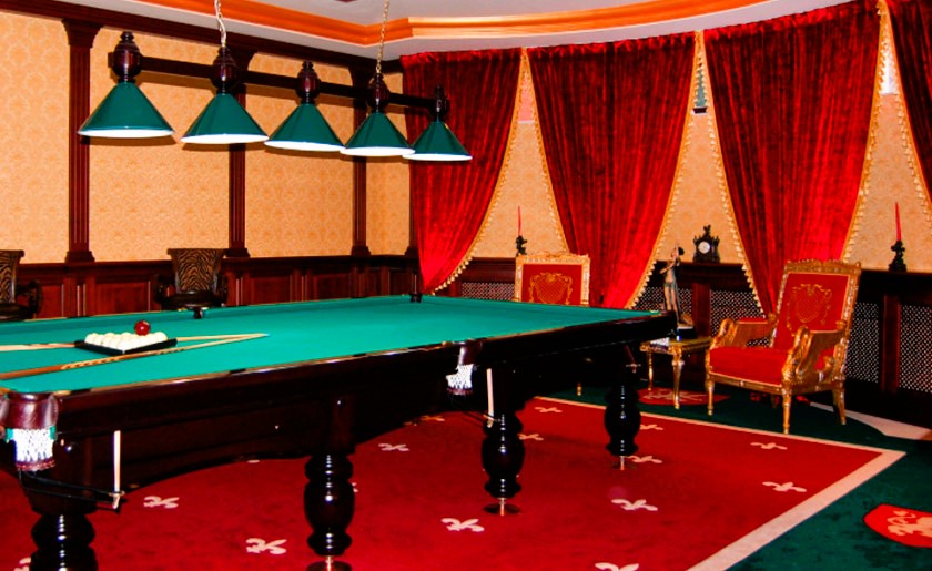 Billiard room rug in interior with billiard table