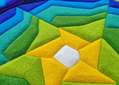 Pile detail of colorful rug — carved relief