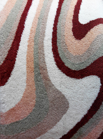 fluffy striped rug is the best solution for bedroom