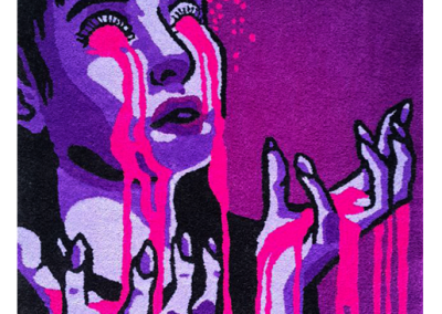 Artistic handmade rug depicting a woman with bloody tears