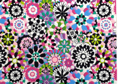Pop Art Floral Carpet This bright, stylish carpet with a floral pattern is made in a pop art style, conveying a joyful sense of youth and cheerfulness. It is perfect for a young girl's room. The carpet is made from eco-friendly British wool using the hand-tufting method. The hand trimming highlights its unique design. This carpet will be a beautiful addition to any interior.