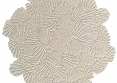 Beige round carpet marshmallow. The finest craftsmanship in carpet shearing.