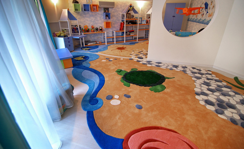 "Custom ocean-themed kids rug with turtle and abstract seaside design in play area" width="100%"