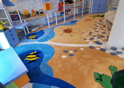 "Functional zoning with two ocean-themed carpets in kids’ room" width="100%"