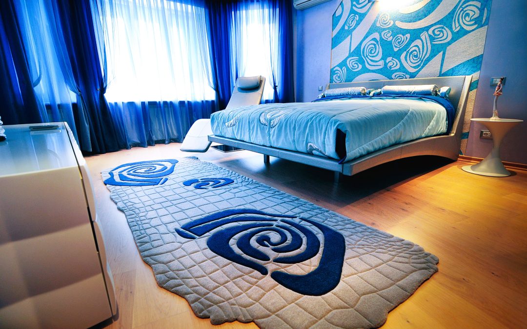 Grey blue rug with pattern and texture in bedroom interior